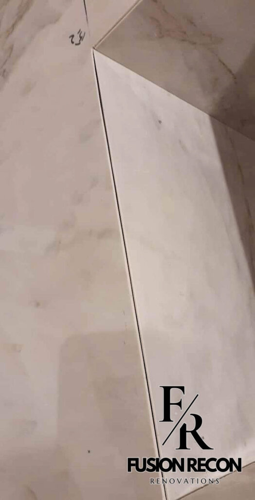 Bathroom with marble effect tiles and contemporary fittings – Camden NW1