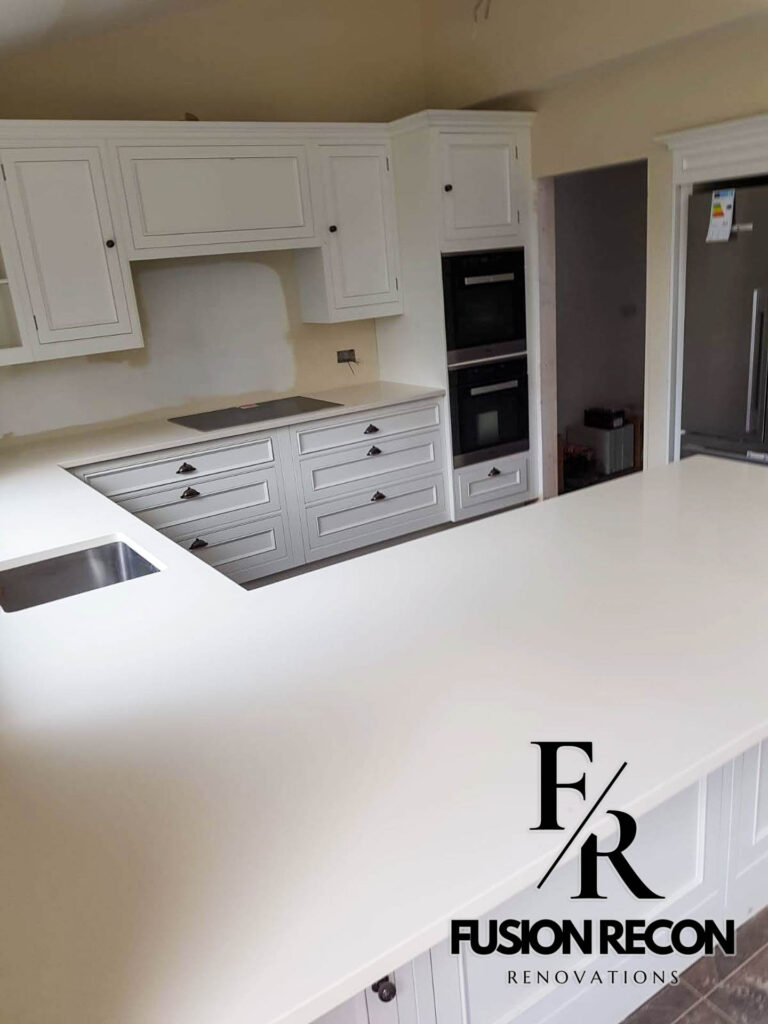 C-shaped kitchen design with bespoke cabinetry and integrated appliances – Putney SW15