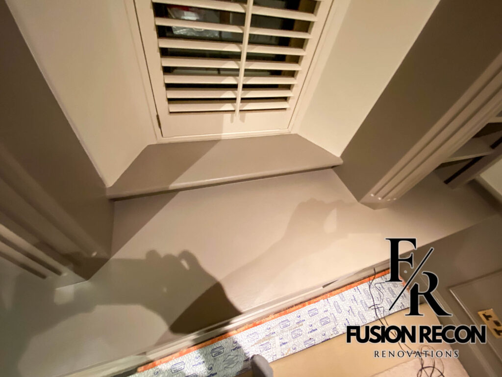 Custom built library unit with fitted shelves and cabinets – Kensington W8