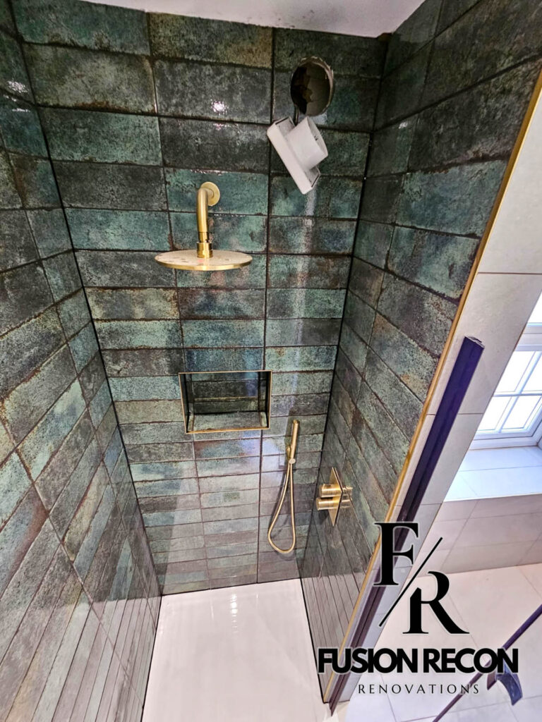 Designer bathroom with gold and black fixtures in a luxury renovation – Chelsea SW3