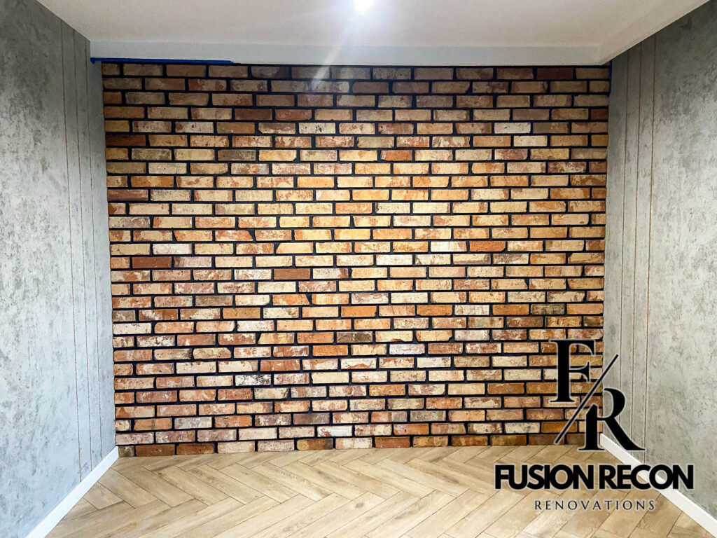 Feature wall with exposed brick slips in a Richmond TW10 home renovation