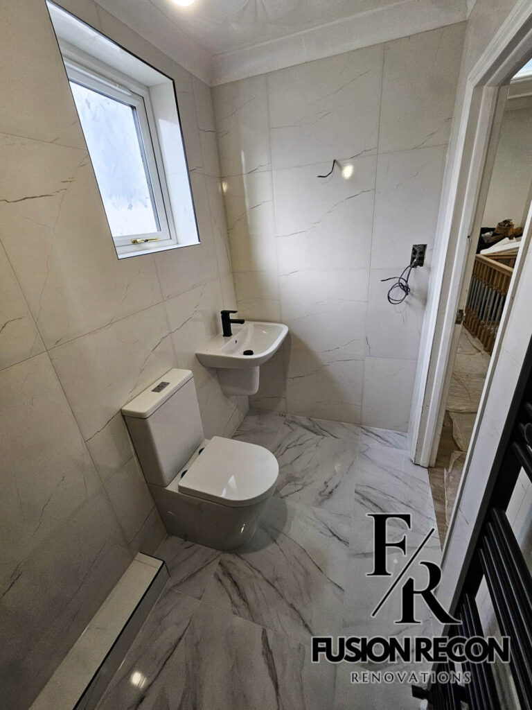 Bathroom with grey marble-effect wall and floor tiles – Richmond TW9