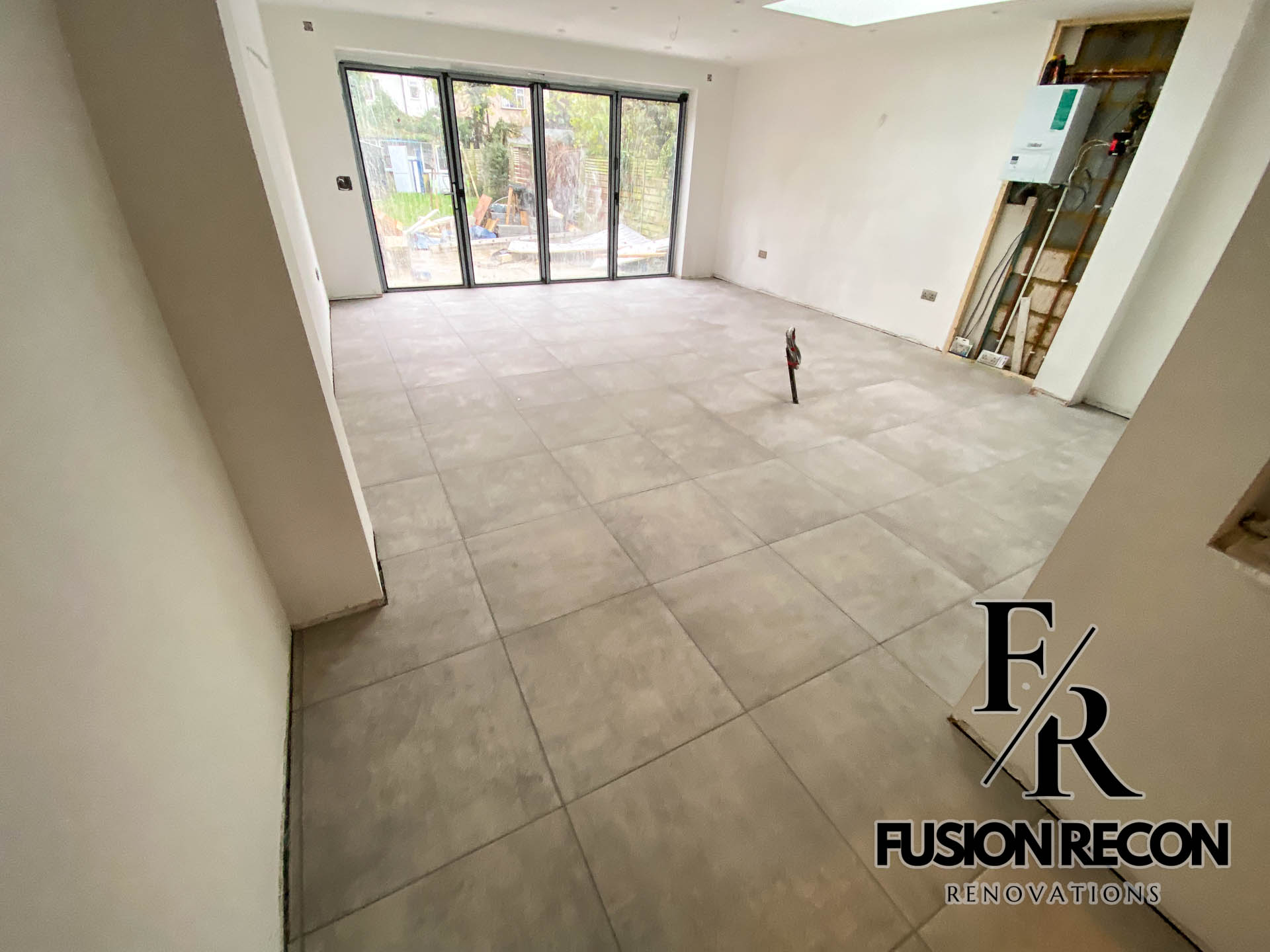 Large-format floor tile installation on the ground floor – Clapham SW4