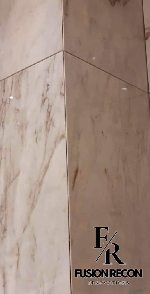 Marble bathroom design with built-in niches and modern fixtures – Camden NW1