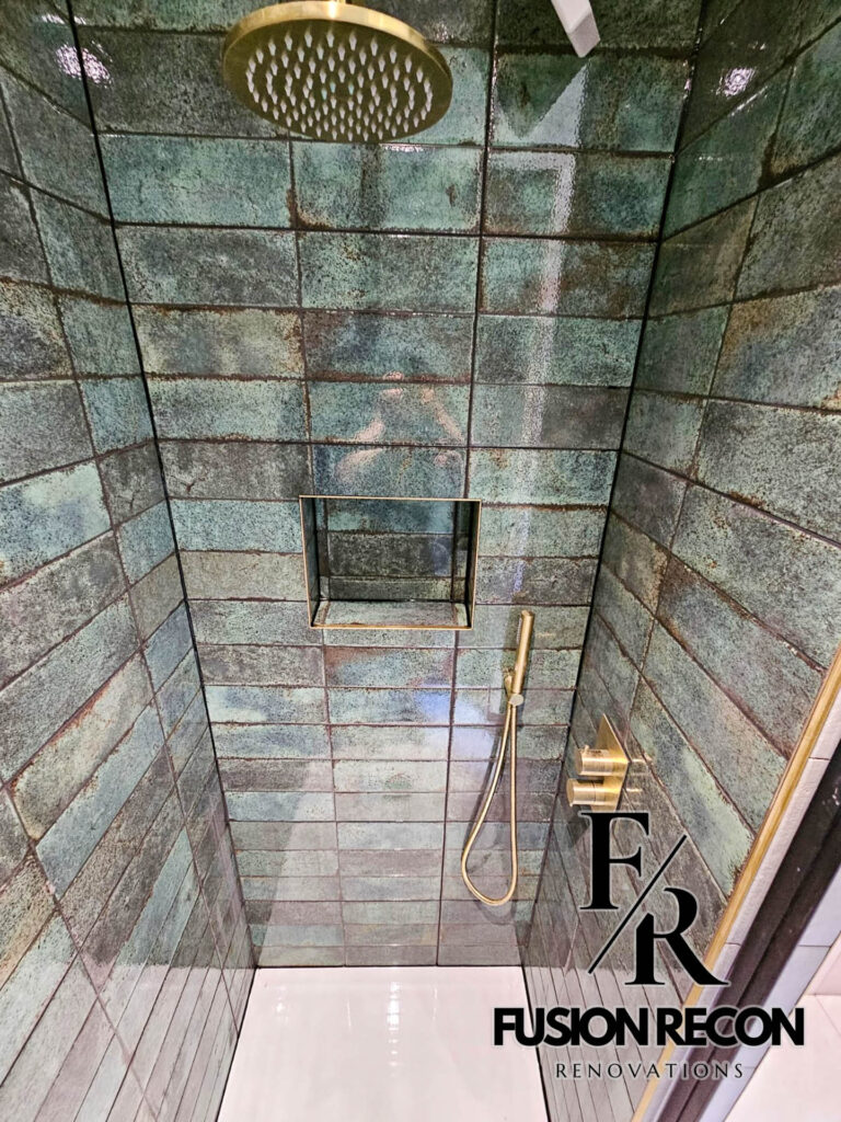 Stylish bathroom with gold and brass accents in a luxury renovation – Chelsea SW3