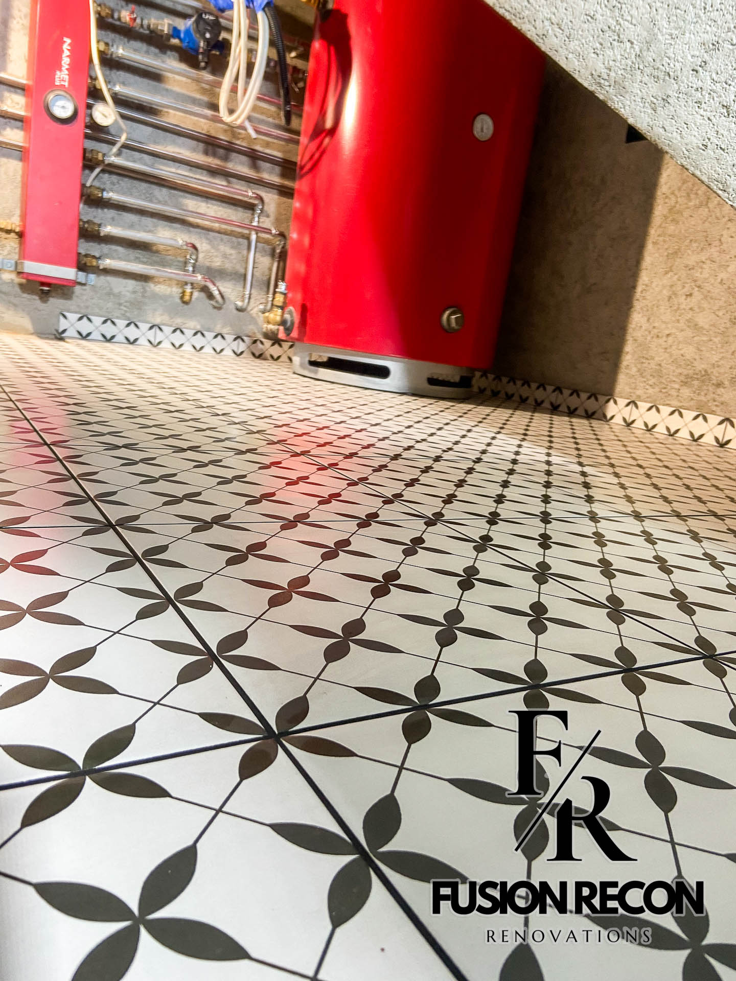 Close-up of Victorian-style floor tiles in a Wimbledon SW19 boiler room