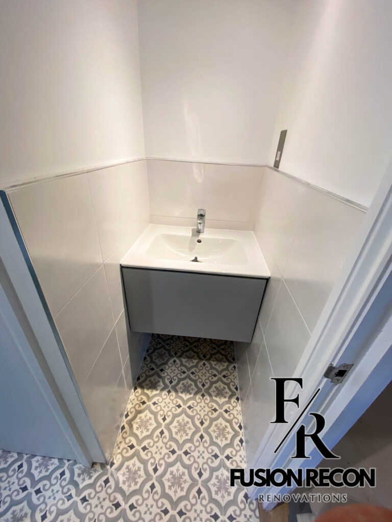 Vintage bathroom renovation with green brick tiles and classic fixtures – Kensington W8
