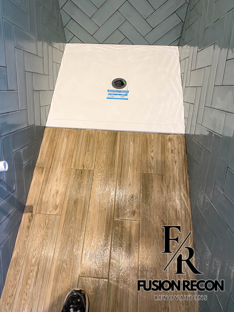 Bathroom with wood-effect flooring and contemporary walk-in shower – Fulham SW6